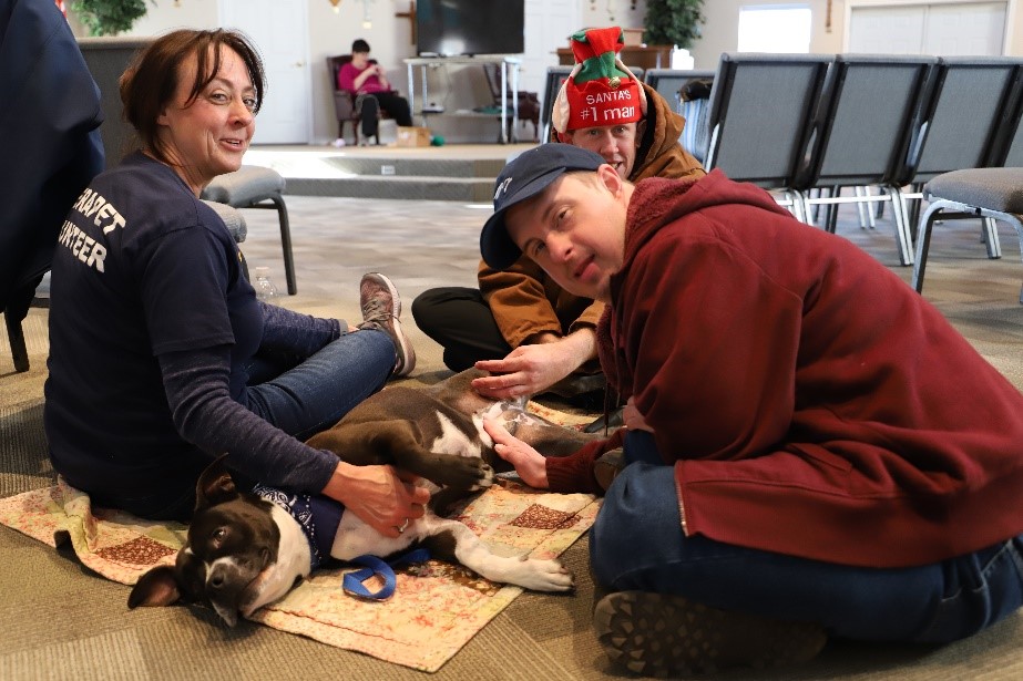 Residents enjoying a visit from Therapet